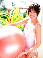 Akina Minami Asian in colorful bath suits plays with big ball